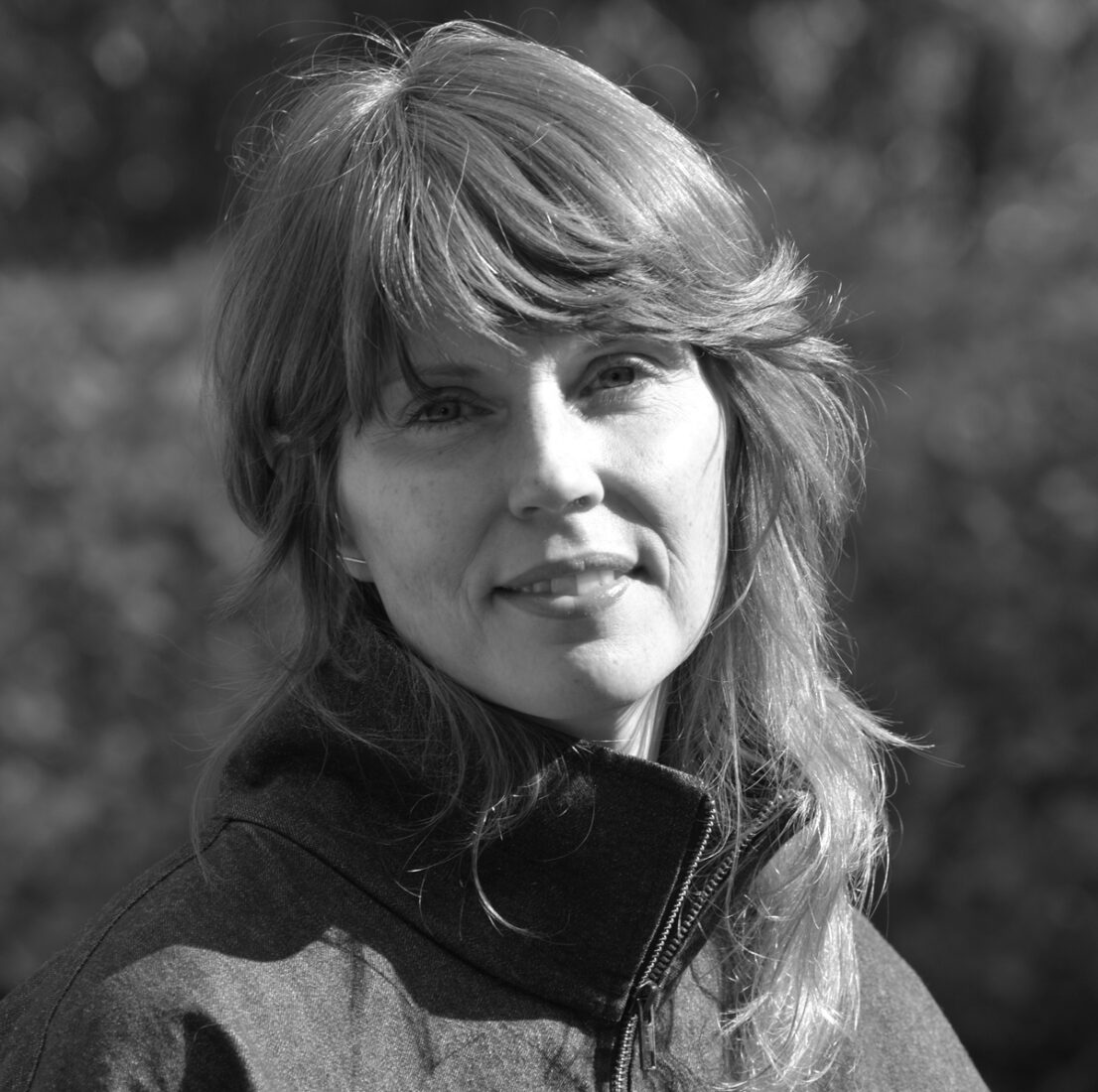 A black and white portrait of artist Heather Gwen Martin
